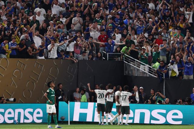 Chelsea's players celebrate after Palmeiras' own goal during the FIFA Club World Cup 2025 quarterfinal football match between Brazil's Palmeiras and England's Chelsea at the Lincoln Financial Field Stadium in Philadelphia on July 4, 2025. (Photo by FRANCK FIFE / AFP)