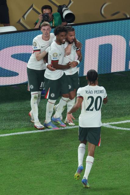 Chelsea's French defender #27 Malo Gusto (2nd-R) celebrates with teammates after scoring his team's second goal during the FIFA Club World Cup 2025 quarterfinal football match between Brazil's Palmeiras and England's Chelsea at the Lincoln Financial Field Stadium in Philadelphia on July 4, 2025. (Photo by CHARLY TRIBALLEAU / AFP)