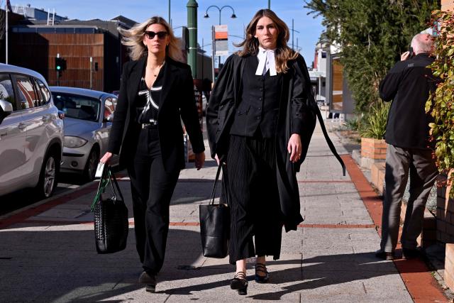 Lawyer Ophelia Holloway (L) and barrister Sophie Stafford (R) arrive at the Latrobe Valley Law Courts in Morwell on July 5, 2025. Jury members retired on June 30 to decide the fate of an Australian woman accused of murdering three members of her husband's family with a toxic mushroom-laced beef Wellington lunch. Jurors began deliberating their verdict on 50-year-old home cook Erin Patterson after a nine-week trial. (Photo by William WEST / AFP)