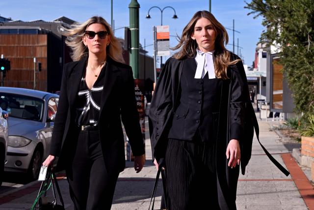 Lawyer Ophelia Holloway (L) and barrister Sophie Stafford (R) arrive at the Latrobe Valley Law Courts in Morwell on July 5, 2025. Jury members retired on June 30 to decide the fate of an Australian woman accused of murdering three members of her husband's family with a toxic mushroom-laced beef Wellington lunch. Jurors began deliberating their verdict on 50-year-old home cook Erin Patterson after a nine-week trial. (Photo by William WEST / AFP)