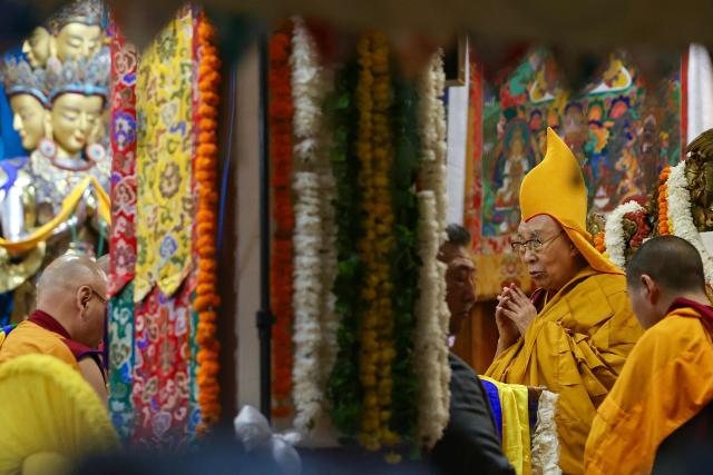 Tibetan spiritual leader the Dalai Lama (2R) attends a long-life prayer offering ceremony at the Main Tibetan Temple in McLeod Ganj, near Dharamsala on July 5, 2025. The Dalai Lama said on July 5 he dreamed of living for decades more, as the Buddhist spiritual leader prayed with thousands of exiled Tibetans on the eve of his 90th birthday. (Photo by Niharika KULKARNI / AFP)
