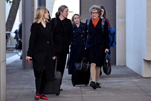 Crown Prosecutor Nanette Rogers (2nd R) leaves at the Latrobe Valley Law Courts in Morwell on July 5, 2025. Jury members retired on June 30 to decide the fate of an Australian woman accused of murdering three members of her husband's family with a toxic mushroom-laced beef Wellington lunch. Jurors began deliberating their verdict on 50-year-old home cook Erin Patterson after a nine-week trial. (Photo by William WEST / AFP)
