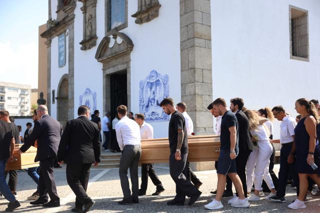Former teammates carry the coffins during the funerals of Liverpool's Portuguese forward Diogo Jota and his brother Andre Silva at the Mother Church of Gondomar, on the outskirts of Porto, on July 5, 2025. Liverpool forward Diogo Jota and his brother died in a car crash in Spain on July 3, 2025, sparking widespread grief just after the Portugal star had got married. (Photo by FILIPE AMORIM / AFP)