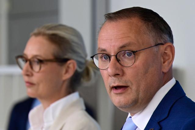 Co-leaders of the far-right Alternative for Germany (AfD) party Tino Chrupalla (R) and Alice Weidel address a press conference after a meeting of the AfD parliamentary group in Berlin on July 5, 2025. (Photo by John MACDOUGALL / AFP)