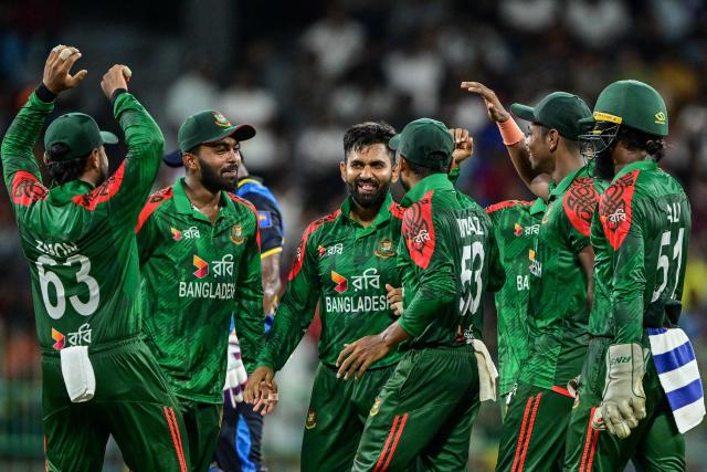 Bangladesh's Shamim Hossain (C) celebrates with teammates after taking the wicket of Sri Lanka's captain Charith Asalanka during the second one-day international (ODI) cricket match between Sri Lanka and Bangladesh at the R. Premadasa International Cricket Stadium in Colombo on July 5, 2025. (Photo by Ishara S. KODIKARA / AFP)