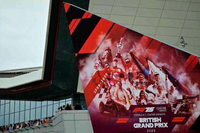 Fans watch the qualifying session ahead of the Formula One British Grand Prix at the Silverstone motor racing circuit in Silverstone, central England, on July 5, 2025. (Photo by Andrej ISAKOVIC / AFP)