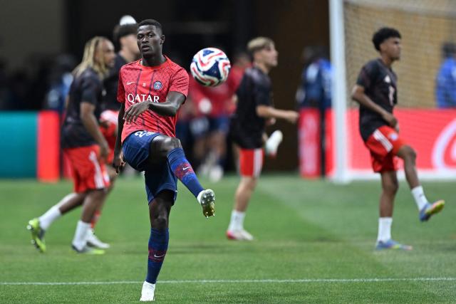 Paris Saint-Germain's Portuguese defender #25 Nuno Mendes warms up before the FIFA Club World Cup 2025 quarterfinal football match between France's Paris Saint-Germain and Germany's Bayern Munich at the Mercedes-Benz Stadium in Atlanta on July 5, 2025. (Photo by PATRICIA DE MELO MOREIRA / AFP)