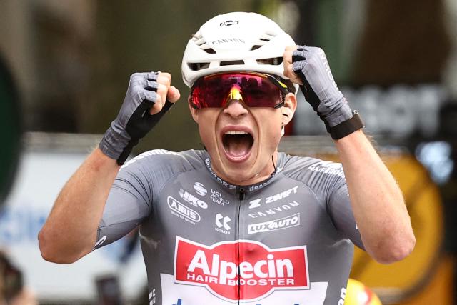 TOPSHOT - Alpecin - Deceuninck team's Belgian rider Jasper Philipsen cycles to the finish line to win the 1st stage of the 112th edition of the Tour de France cycling race, 184.9 km starting and finishing in Lille Metropole, northern France, on July 5, 2025. (Photo by Anne-Christine POUJOULAT / AFP)