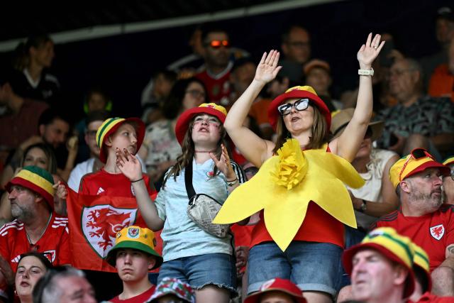 Welsh supporters cheer before the start of the UEFA Women's Euro 2025 Group D football match between Wales and The Netherlands at the Allmend Stadion Luzern in Lucerne on July 5, 2025. (Photo by Fabrice COFFRINI / AFP)