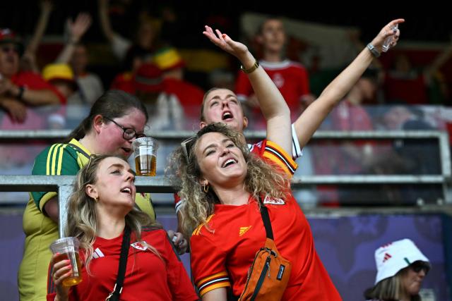 Welsh supporters cheer before the start of the UEFA Women's Euro 2025 Group D football match between Wales and The Netherlands at the Allmend Stadion Luzern in Lucerne on July 5, 2025. (Photo by Fabrice COFFRINI / AFP)