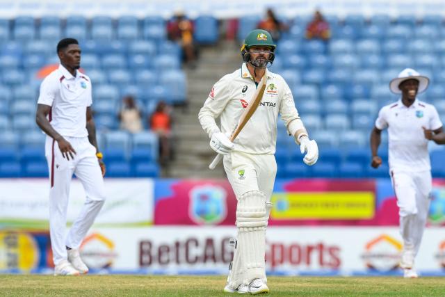 Nathan Lyon (C) of Australia walks off the field after being dismissed by Alzarri Joseph (L) of West Indies during the 3rd day of the 2nd Test match between West Indies and Australia at Grenada National Cricket Stadium, Saint George's, Grenada, on July 5, 2025. (Photo by Randy Brooks / AFP)