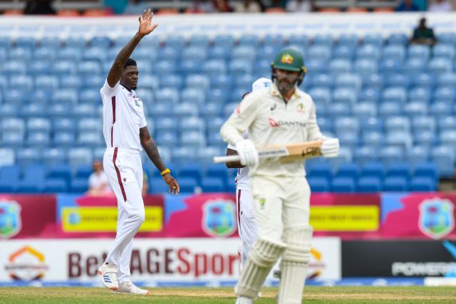 Alzarri Joseph (L) of West Indies celebrates the dismissal of Nathan Lyon (R) of Australia during the 3rd day of the 2nd Test match between West Indies and Australia at Grenada National Cricket Stadium, Saint George's, Grenada, on July 5, 2025. (Photo by Randy Brooks / AFP)
