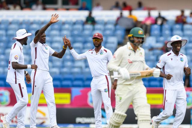 Alzarri Joseph (2L) and Kraigg Brathwaite (C) of West Indies celebrate the dismissal of Nathan Lyon (2R) of Australia during the 3rd day of the 2nd Test match between West Indies and Australia at Grenada National Cricket Stadium, Saint George's, Grenada, on July 5, 2025. (Photo by Randy Brooks / AFP)