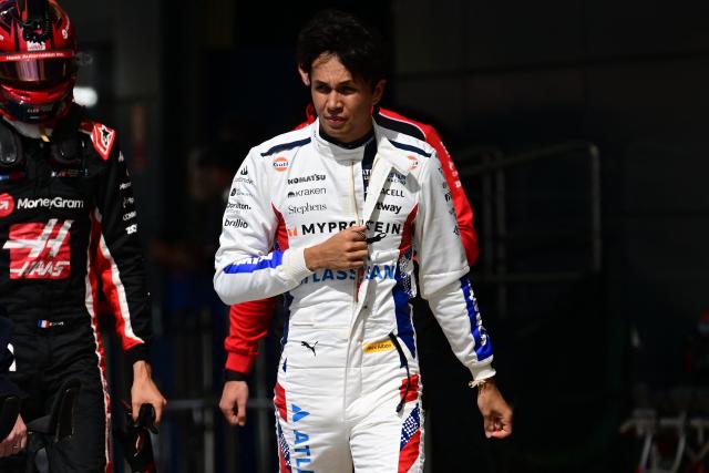Williams' Thai driver Alexander Albon walks back during the qualifying session ahead of the Formula One British Grand Prix at the Silverstone motor racing circuit in Silverstone, central England, on July 5, 2025. (Photo by Ben STANSALL / POOL / AFP)