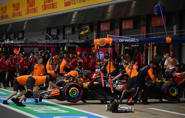 The McLaren of Australian driver Oscar Piastri is pushed back into the garage during the qualifying session ahead of the Formula One British Grand Prix at the Silverstone motor racing circuit in Silverstone, central England, on July 5, 2025. (Photo by Ben STANSALL / POOL / AFP)