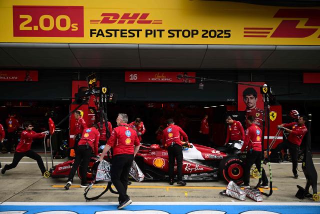 The Ferrari of Monegasque driver Charles Leclerc returns to his garage during the qualifying session ahead of the Formula One British Grand Prix at the Silverstone motor racing circuit in Silverstone, central England, on July 5, 2025. (Photo by Ben STANSALL / POOL / AFP)