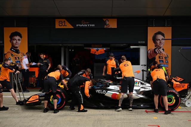 McLaren's Australian driver Oscar Piastri returns to his garage during the qualifying session ahead of the Formula One British Grand Prix at the Silverstone motor racing circuit in Silverstone, central England, on July 5, 2025. (Photo by Ben STANSALL / POOL / AFP)