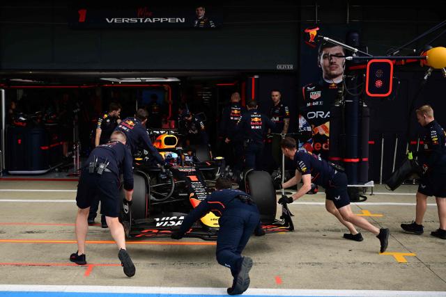 Red Bull Racing's Dutch driver Max Verstappen returns to his garage during the qualifying session ahead of the Formula One British Grand Prix at the Silverstone motor racing circuit in Silverstone, central England, on July 5, 2025. (Photo by Ben STANSALL / POOL / AFP)