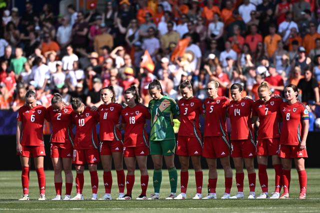 (From L) Wales' defender #06 Josephine Green, Wales' defender #02 Lily Woodham, Wales' midfielder #10 Jessica Fishlock, Wales' forward #11 Hannah Cain, Wales' defender #18 Esther Morgan, Wales' goalkeeper #01 Olivia Clark, Wales' defender #03 Gemma Evans, Wales' defender #05 Rhiannon Roberts, Wales' defender #14 Hayley Ladd, Wales' midfielder #07 Ceri Holland and Wales' midfielder #08 Angharad James team players, observe a minute of silence to pay tribute to Liverpool Portuguese forward Diogo Jota who passed on July 3 in a car crash in Spain, ahead of the  UEFA Women's Euro 2025 Group D football match between Wales and The Netherlands at the Allmend Stadion Luzern in Lucerne on July 5, 2025. (Photo by Fabrice COFFRINI / AFP)