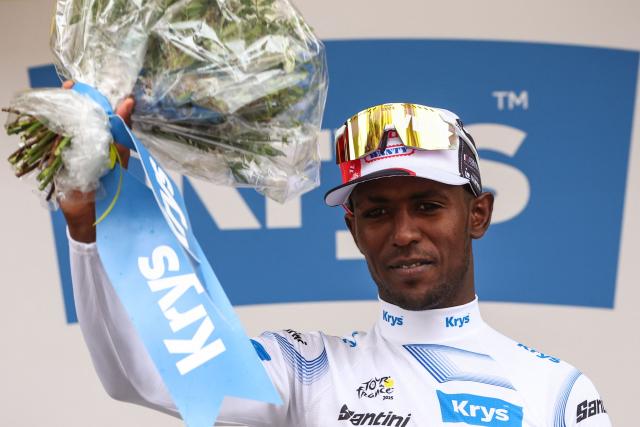 Guest, Intermarch - Wanty team's Eritrean rider Biniam Girmay celebrates on the podium with the best young rider's white jersey after the 1st stage of the 112th edition of the Tour de France cycling race, 184.9 km starting and finishing in Lille Metropole, northern France, on July 5, 2025. (Photo by Anne-Christine POUJOULAT / AFP)