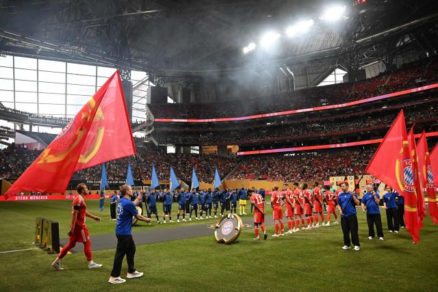 Paris Saint-Germain and Bayern Munich players stand ahead of the FIFA Club World Cup 2025 quarterfinal football match between France's Paris Saint-Germain and Germany's Bayern Munich at the Mercedes-Benz Stadium in Atlanta on July 5, 2025. (Photo by Paul ELLIS / AFP)