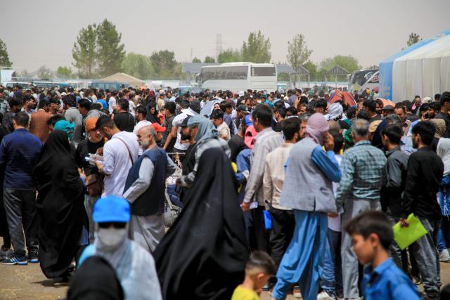 Afghan refugees arrive from Iran at Islam Qala border between Afghanistan and Iran, on July 5, 2025. At Herat province's Islam Qala crossing, the checkpoint is usually busy handling everything from smuggling to deportation as young men seek work in Iran. But since Tehran ordered Afghans without the right to remain to leave by July 6, the number of returnees -- especially families -- has surged. (Photo by Mohsen KARIMI / AFP)