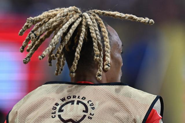 Bayern Munich's French defender #23 Sacha Boey warms up during the FIFA Club World Cup 2025 quarterfinal football match between France's Paris Saint-Germain and Germany's Bayern Munich at the Mercedes-Benz Stadium in Atlanta on July 5, 2025. (Photo by Paul ELLIS / AFP)