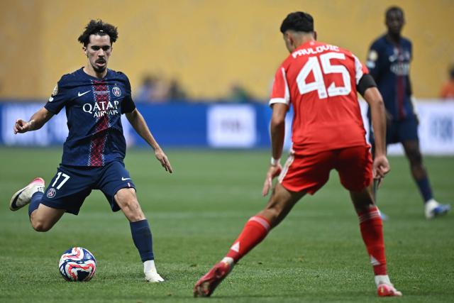 Paris Saint-Germain's Portuguese midfielder #17 Vitinha controls the ball past Bayern Munich's German midfielder #45 Aleksandar Pavlovic during the FIFA Club World Cup 2025 quarterfinal football match between France's Paris Saint-Germain and Germany's Bayern Munich at the Mercedes-Benz Stadium in Atlanta on July 5, 2025. (Photo by Paul ELLIS / AFP)