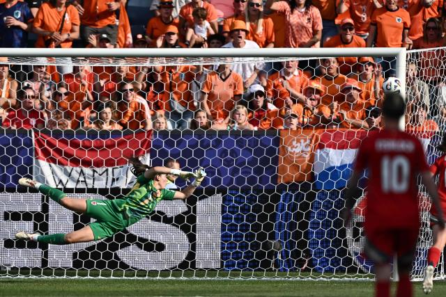 Wales' goalkeeper #01 Olivia Clark deflects the ball during the UEFA Women's Euro 2025 Group D football match between Wales and The Netherlands at the Allmend Stadion Luzern in Lucerne on July 5, 2025. (Photo by Fabrice COFFRINI / AFP)