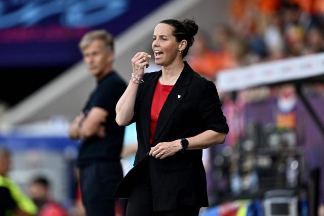 Wales' coach Rhian Wilkinson applies lip balm during the UEFA Women's Euro 2025 Group D football match between Wales and The Netherlands at the Allmend Stadion Luzern in Lucerne on July 5, 2025. (Photo by Fabrice COFFRINI / AFP)