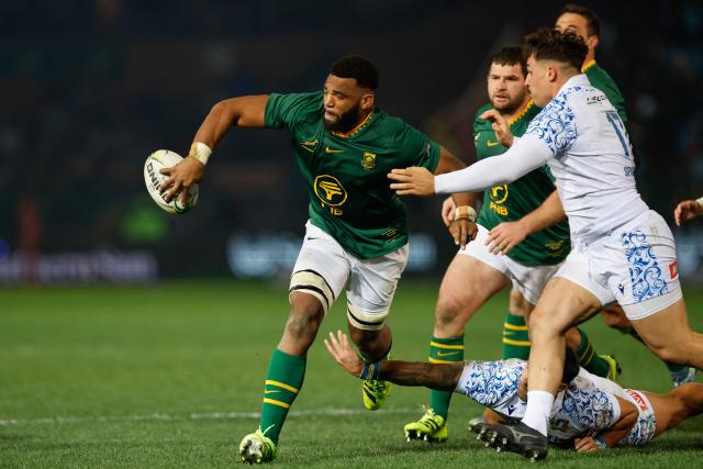 South Africa's flanker Vincent Tshituka (L) passes the ball during the international rugby union Test match between South Africa and Italy at Loftus Versfeld stadium in Pretoria on July 5, 2025. (Photo by PHILL MAGAKOE / AFP)