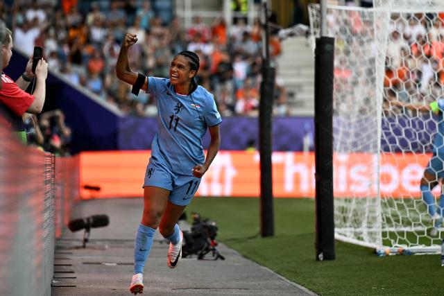 Netherlands' forward #11 Esmee Brugts celebrates after she scored the third goal of the match during the UEFA Women's Euro 2025 Group D football match between Wales and The Netherlands at the Allmend Stadion Luzern in Lucerne on July 5, 2025. (Photo by Fabrice COFFRINI / AFP)