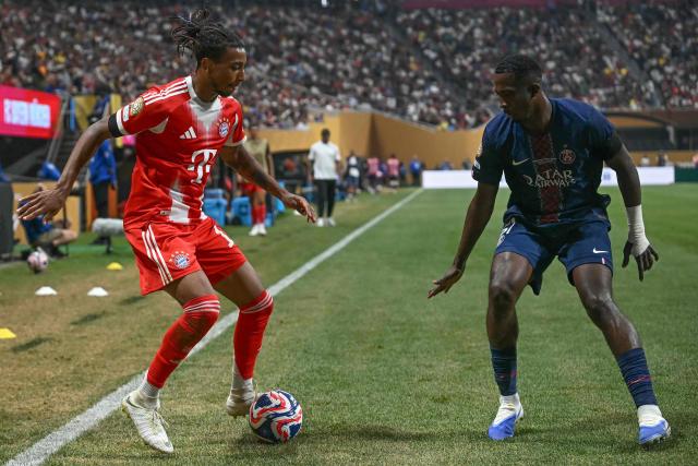 Bayern Munich's French midfielder #17 Michael Olise controls the ball past Paris Saint-Germain's Ecuadorian defender #51 William Pacho during the FIFA Club World Cup 2025 quarterfinal football match between France's Paris Saint-Germain and Germany's Bayern Munich at the Mercedes-Benz Stadium in Atlanta on July 5, 2025. (Photo by Paul ELLIS / AFP)