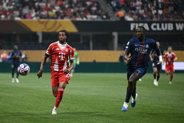 Bayern Munich's French midfielder #17 Michael Olise and Paris Saint-Germain's Ecuadorian defender #51 William Pacho fight for the ball during the FIFA Club World Cup 2025 quarterfinal football match between France's Paris Saint-Germain and Germany's Bayern Munich at the Mercedes-Benz Stadium in Atlanta on July 5, 2025. (Photo by Paul ELLIS / AFP)