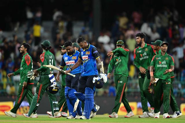 Bangladeshi and Sri Lanka players walk back to the pavilion at the end of the second one-day international (ODI) cricket match between Sri Lanka and Bangladesh at the R. Premadasa International Cricket Stadium in Colombo on July 5, 2025. (Photo by Ishara S. KODIKARA / AFP)