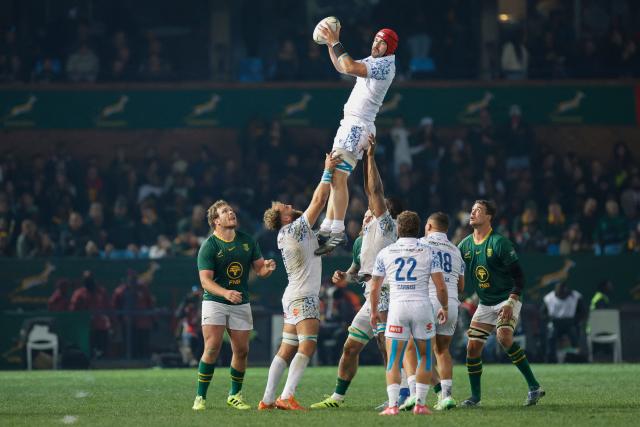 Italy's lock Matteo Canali (top) catches the ball in a line-out during the international rugby union Test match between South Africa and Italy at Loftus Versfeld stadium in Pretoria on July 5, 2025. (Photo by PHILL MAGAKOE / AFP)