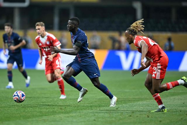 Paris Saint-Germain's Portuguese defender #25 Nuno Mendes (C) controls the ball during the FIFA Club World Cup 2025 quarterfinal football match between France's Paris Saint-Germain and Germany's Bayern Munich at the Mercedes-Benz Stadium in Atlanta on July 5, 2025. (Photo by PATRICIA DE MELO MOREIRA / AFP)