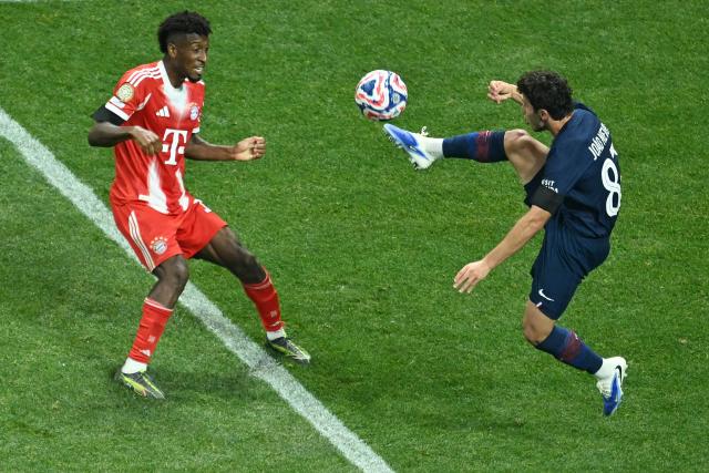 Paris Saint-Germain's Portuguese midfielder #87 Joao Pedro Goncalves Neves (R) controls the ball past Bayern Munich's French forward #11 Kingsley Coman (L) during the FIFA Club World Cup 2025 quarterfinal football match between France's Paris Saint-Germain and Germany's Bayern Munich at the Mercedes-Benz Stadium in Atlanta on July 5, 2025. (Photo by ROBERTO SCHMIDT / AFP)