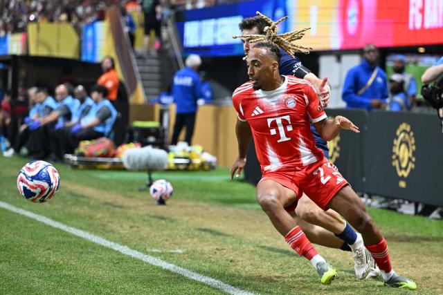 Bayern Munich's French defender #23 Sacha Boey fights for the ball during the FIFA Club World Cup 2025 quarterfinal football match between France's Paris Saint-Germain and Germany's Bayern Munich at the Mercedes-Benz Stadium in Atlanta on July 5, 2025. (Photo by PATRICIA DE MELO MOREIRA / AFP)