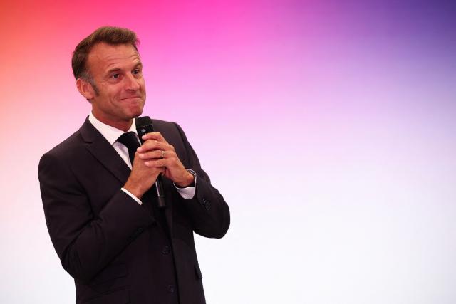 France's President Emmanuel delivers a speech during a rally marking the 10th anniversary of "Les Jeunes avec Macron" (Youth with Macron), the youth movement of the Renaissance party, at the Cirque d'Hiver in Paris on July 5, 2025. (Photo by Sebastien DUPUY / AFP)