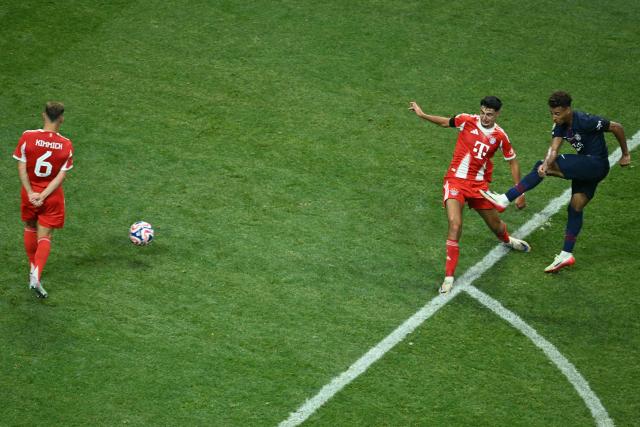 Paris Saint-Germain's French midfielder #14 Desire Doue (R) scores the opening goal during the FIFA Club World Cup 2025 quarterfinal football match between France's Paris Saint-Germain and Germany's Bayern Munich at the Mercedes-Benz Stadium in Atlanta on July 5, 2025. (Photo by ROBERTO SCHMIDT / AFP)