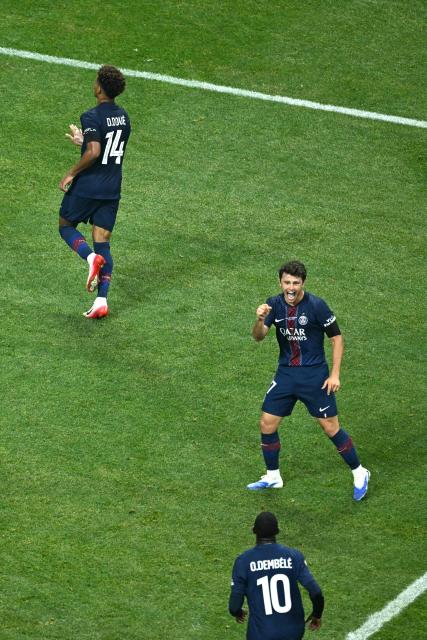 Paris Saint-Germain's French midfielder #14 Desire Doue (T) celebrates with teammate Portuguese midfielder #87 Joao Pedro Goncalves Neves (C) and French forward #10 Ousmane Dembele (B) after scoring his team's first goal during the FIFA Club World Cup 2025 quarterfinal football match between France's Paris Saint-Germain and Germany's Bayern Munich at the Mercedes-Benz Stadium in Atlanta on July 5, 2025. (Photo by ROBERTO SCHMIDT / AFP)