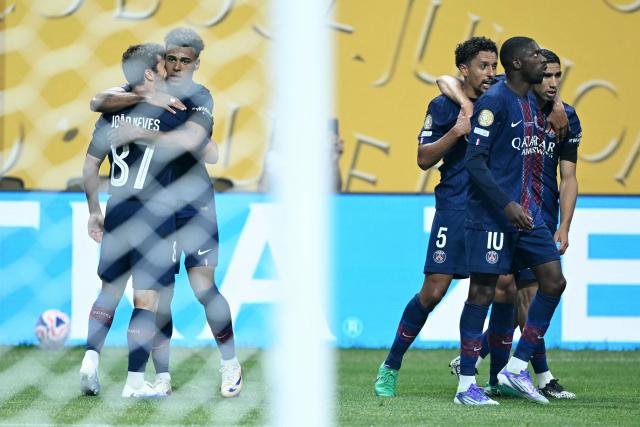 Paris Saint-Germain's French midfielder #14 Desire Doue (2-R) celebrates scoring his team's first goal with teammates during the FIFA Club World Cup 2025 quarterfinal football match between France's Paris Saint-Germain and Germany's Bayern Munich at the Mercedes-Benz Stadium in Atlanta on July 5, 2025. (Photo by PATRICIA DE MELO MOREIRA / AFP)