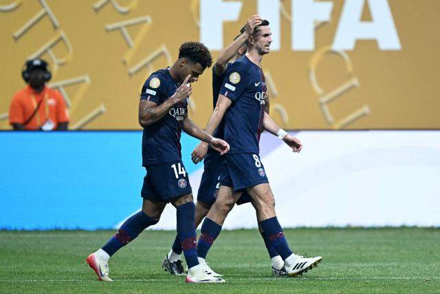 Paris Saint-Germain's French midfielder #14 Desire Doue (L) celebrates scoring his team's first goal during the FIFA Club World Cup 2025 quarterfinal football match between France's Paris Saint-Germain and Germany's Bayern Munich at the Mercedes-Benz Stadium in Atlanta on July 5, 2025. (Photo by PATRICIA DE MELO MOREIRA / AFP)