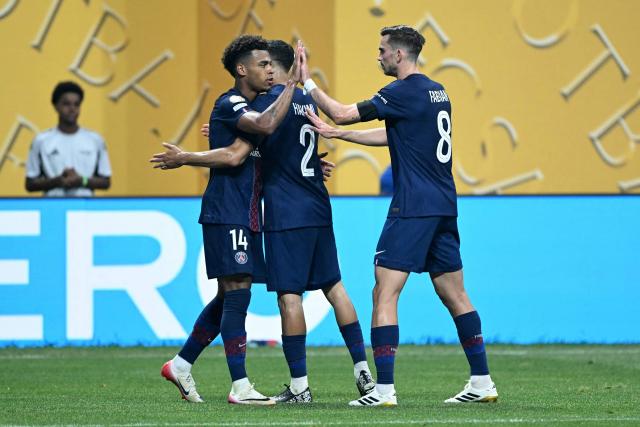 Paris Saint-Germain's French midfielder #14 Desire Doue (L) celebrates scoring his team's first goal during the FIFA Club World Cup 2025 quarterfinal football match between France's Paris Saint-Germain and Germany's Bayern Munich at the Mercedes-Benz Stadium in Atlanta on July 5, 2025. (Photo by PATRICIA DE MELO MOREIRA / AFP)