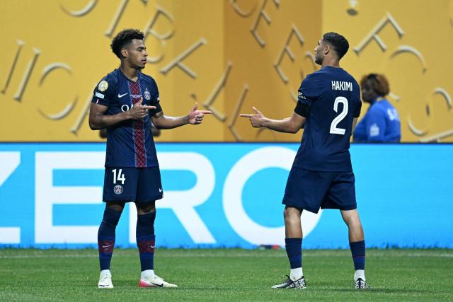 Paris Saint-Germain's French midfielder #14 Desire Doue celebrates scoring the opening goal with Paris Saint-Germain's Moroccan defender #02 Achraf Hakimi during the FIFA Club World Cup 2025 quarterfinal football match between France's Paris Saint-Germain and Germany's Bayern Munich at the Mercedes-Benz Stadium in Atlanta on July 5, 2025. (Photo by PATRICIA DE MELO MOREIRA / AFP)