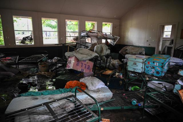A view inside of a cabin at Camp Mystic, the site of where at least 20 girls went missing after flash flooding in Hunt, Texas, on July 5, 2025. Rescuers were on Saturday searching for more than 20 girls missing from a riverside summer camp in the US state of Texas, after torrential rains caused devastating flooding that killed at least 27 people -- with more rain on the way. "So far, we've evacuated over 850 uninjured people, eight injured people and have recovered 27 deceased fatalities at this time. Of these 27, 18 are adults, nine are children," said Kerr Country Sheriff Larry Leitha on July 5. (Photo by RONALDO SCHEMIDT / AFP)