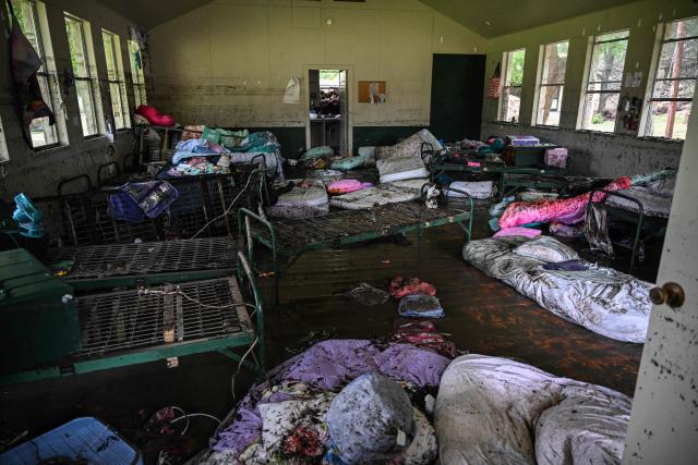 TOPSHOT - A view inside of a cabin at Camp Mystic, the site of where at least 20 girls went missing after flash flooding in Hunt, Texas, on July 5, 2025. Rescuers were on Saturday searching for more than 20 girls missing from a riverside summer camp in the US state of Texas, after torrential rains caused devastating flooding that killed at least 27 people -- with more rain on the way. "So far, we've evacuated over 850 uninjured people, eight injured people and have recovered 27 deceased fatalities at this time. Of these 27, 18 are adults, nine are children," said Kerr Country Sheriff Larry Leitha on July 5. (Photo by RONALDO SCHEMIDT / AFP)