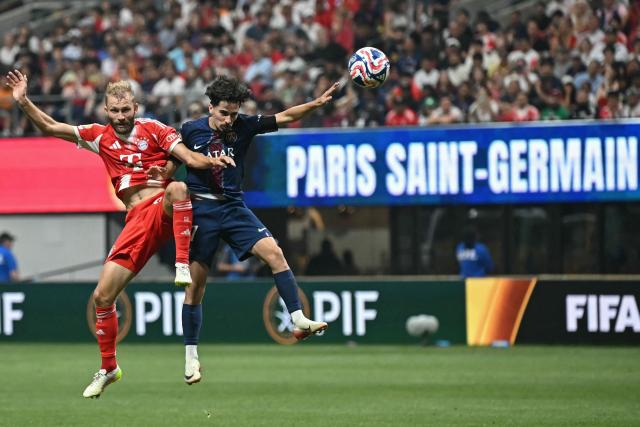 Bayern Munich's Austrian midfielder #27 Konrad Laimer and Paris Saint-Germain's Portuguese midfielder #17 Vitinha fight for the ball during the FIFA Club World Cup 2025 quarterfinal football match between France's Paris Saint-Germain and Germany's Bayern Munich at the Mercedes-Benz Stadium in Atlanta on July 5, 2025. (Photo by Paul ELLIS / AFP)