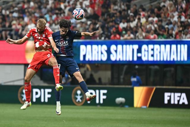 Bayern Munich's Austrian midfielder #27 Konrad Laimer and Paris Saint-Germain's Portuguese midfielder #17 Vitinha fight for the ball during the FIFA Club World Cup 2025 quarterfinal football match between France's Paris Saint-Germain and Germany's Bayern Munich at the Mercedes-Benz Stadium in Atlanta on July 5, 2025. (Photo by Paul ELLIS / AFP)